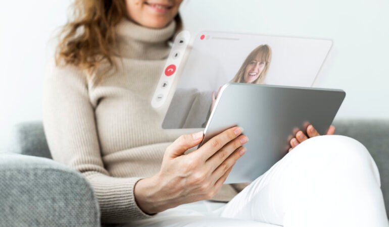 Woman using tablet for video call